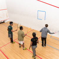 Students playing squash thumbnail
